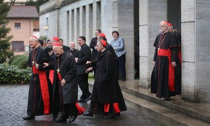 The cardinals head to mass on March 12 before entering the conclave to choose the next pope.