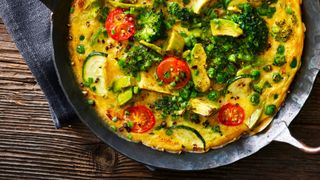 Omelette with green vegetables and tomatoes