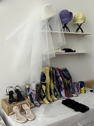 Shoes and bags backstage at Conner Ives A/W 2023 show