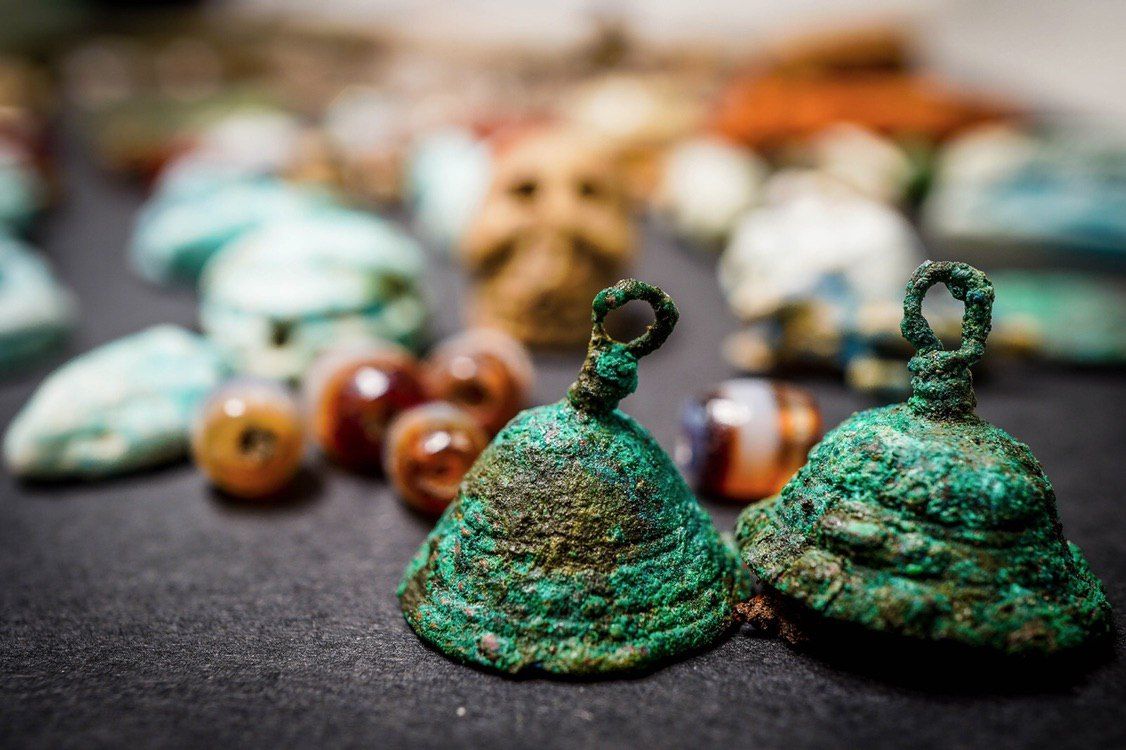If the owner of this amulet collection made it to safety, she didn't have time to grab these charms before she left.