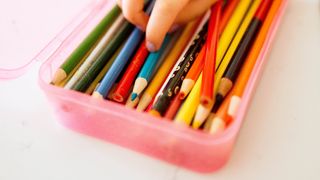 Pencils in a plastic container