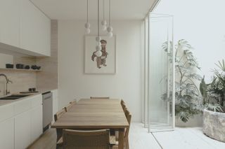 Antonio Solá housing interior with wooden dining table