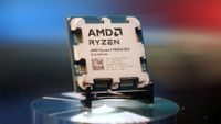 AMD Ryzen 9 9950X3D2 desktop processor on a display stand with a blurred background