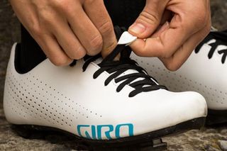 Giro Empire W cycling shoe in the image is being tightened up by the wearer