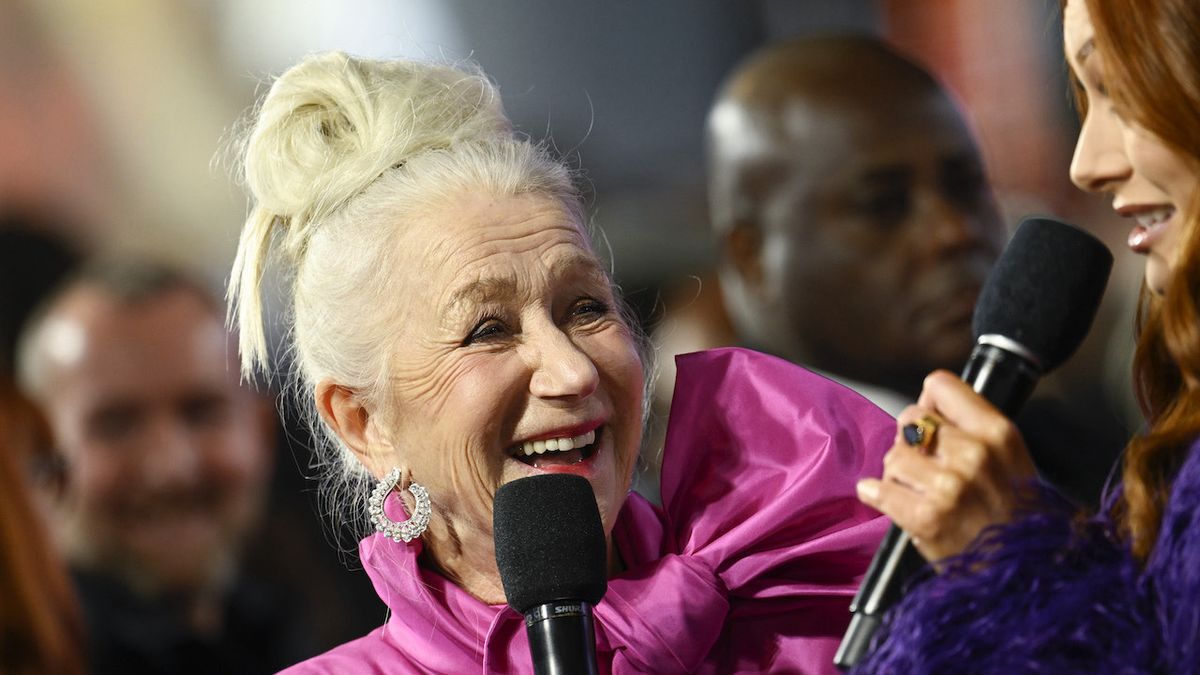 Helen Mirren with a mic at the premiere of Shazam 2