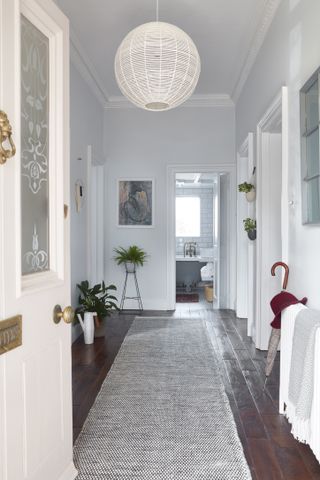 Bright and light hallway with jute runner