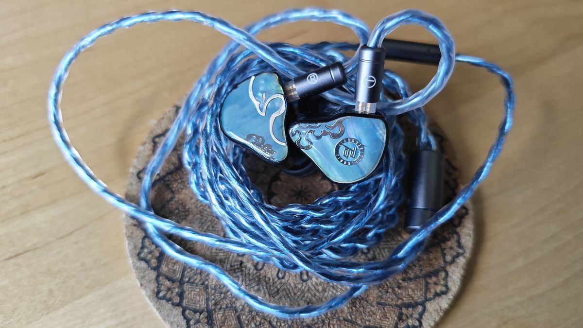 Three photos of the Juzear Defiant IEM.