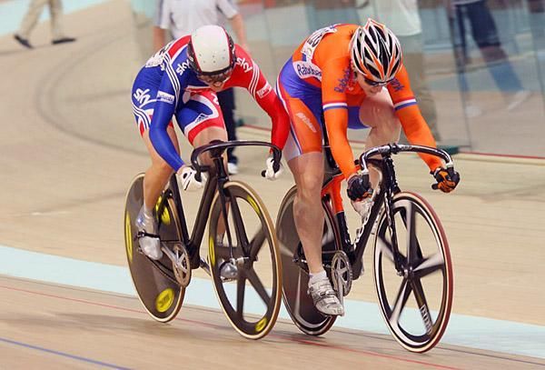 Victoria Pendleton (Great Britain) battles Willy Kanis (Netherlands) for the women's sprint world championship.