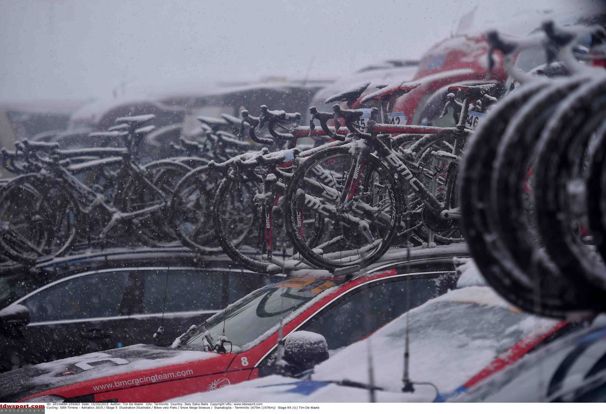The team cars were covered in snow just past the finish line