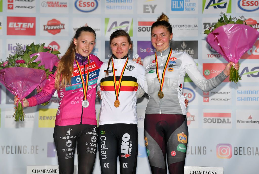 MIDDELKERKE BELGIUM JANUARY 08 LR Silver medalists Julie Brouwers of Belgium gold medalists Kiona Crabbe of Belgium and bronze medalists Sterre Vervloet of Belgium pose on the podium during the medal ceremony after the 105th Belgian National Cyclocross Championships 2022 Womens U23 bkmiddelkerke on January 08 2022 in Middelkerke Belgium Photo by Luc ClaessenGetty Images