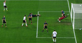 Lukas Podolski of Germany celebrates scoring the first goal during the 2010 FIFA World Cup South Africa Group D match between Germany and Australia at Durban Stadium on June 13, 2010 in Durban, South Africa.