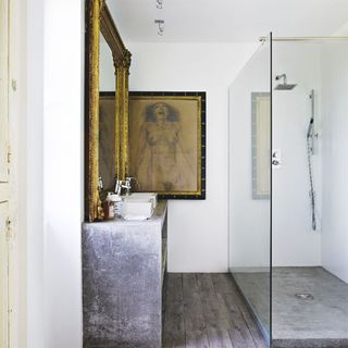 bathroom with frame on white wall and mirror with shower room
