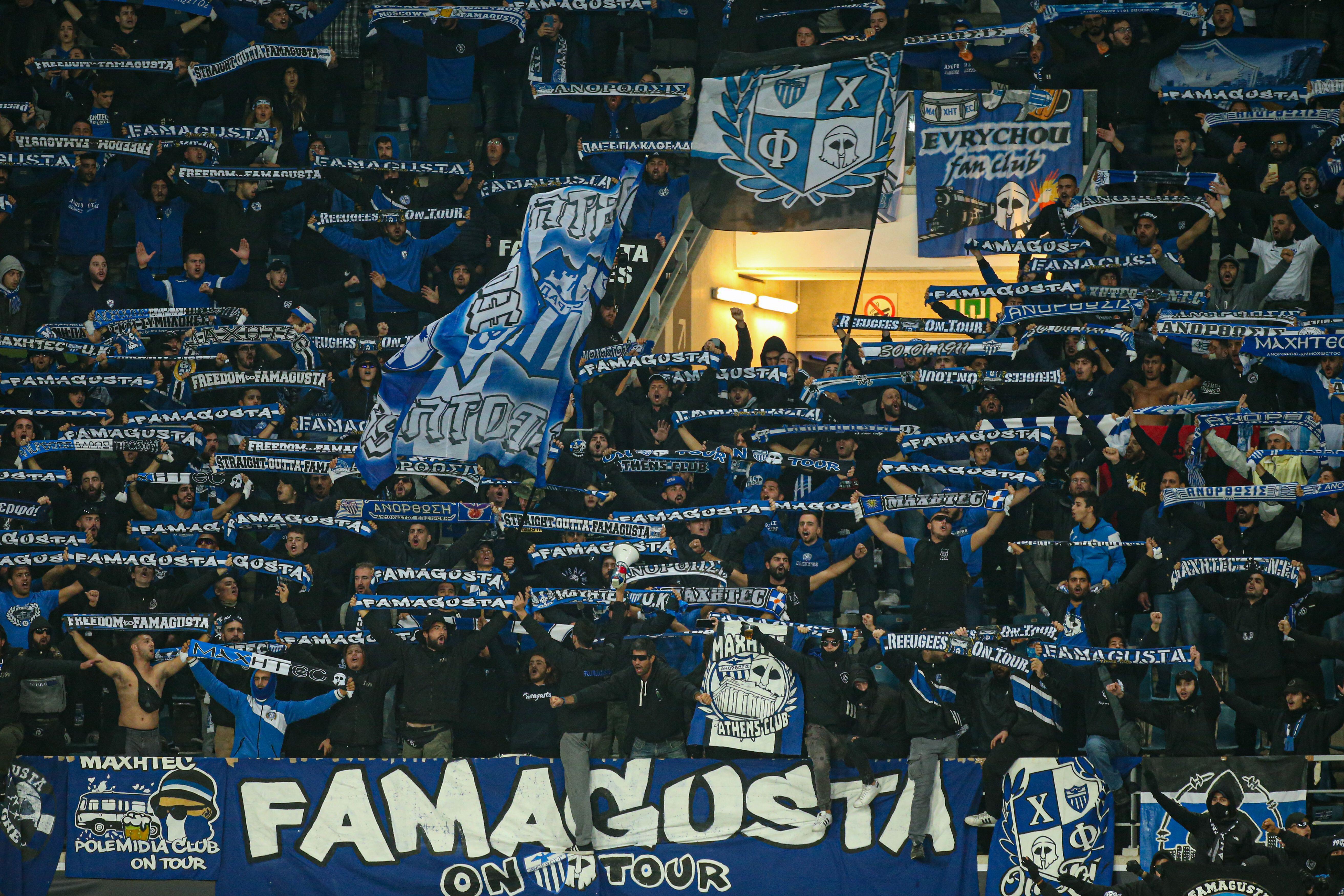 Anorthosis Famagusta fans holding up scarves, flags and banners in the stands, 2021