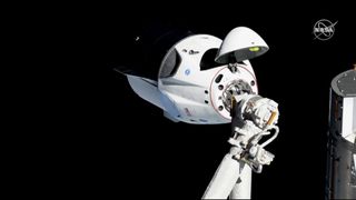 SpaceX&#039;s first Crew Dragon is seen at the International Space Station just before docking on March 3, 2019 during the Demo-1 test flight.