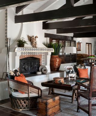 A spanish-style living room with original tiles and collected furniture