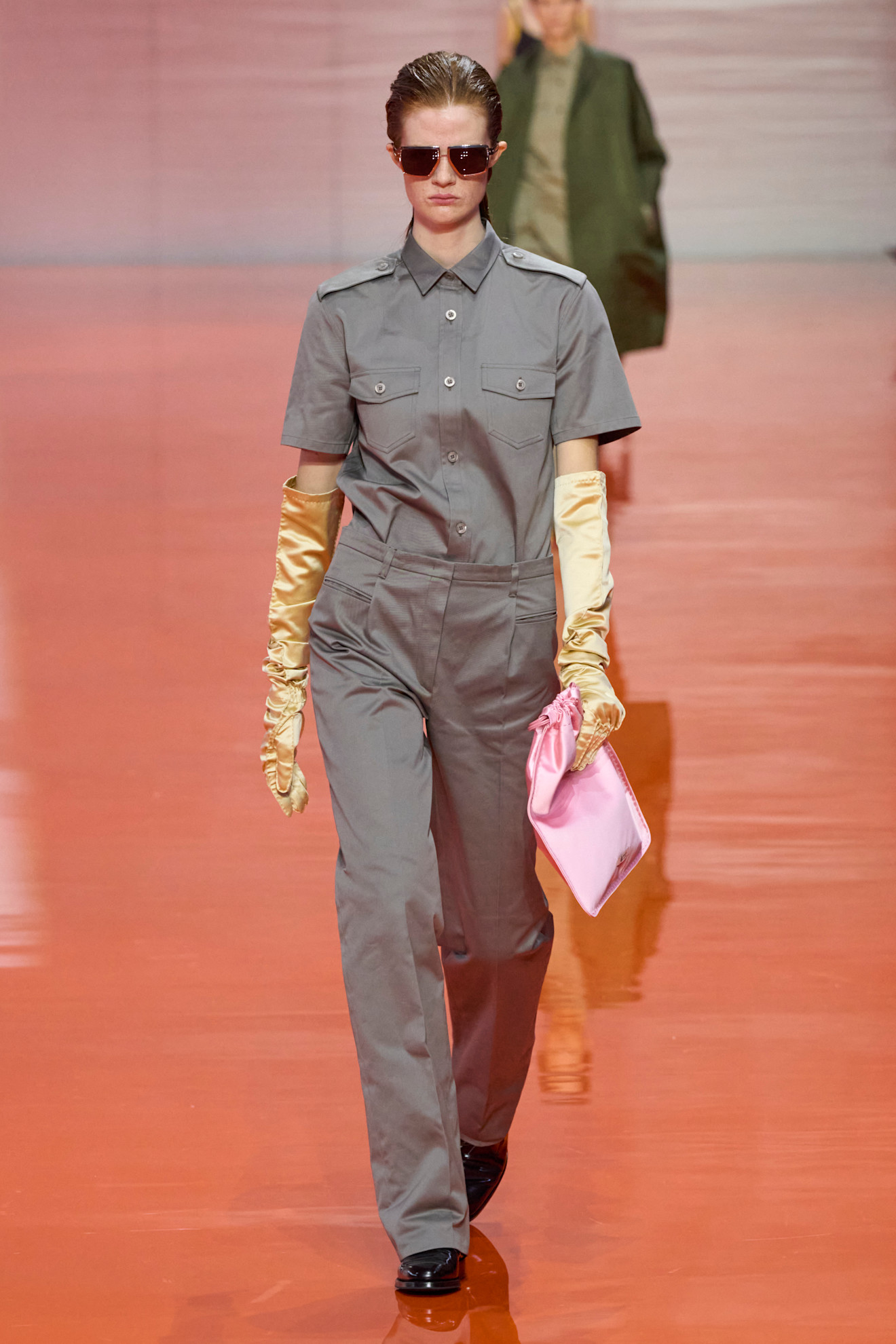 Model wears slate grey on the Prada runway.