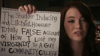 Emma stone holding up a sign that says The Shudder-Inducing-and-Clichéd, However-Totally-False Account Of How I Lost My Virginity To A Guy At A Community College. in Easy A.