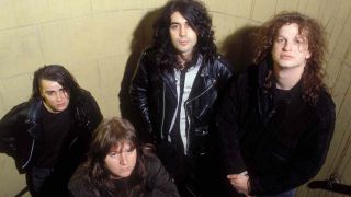 Voivod standing in a stairwell in 1989