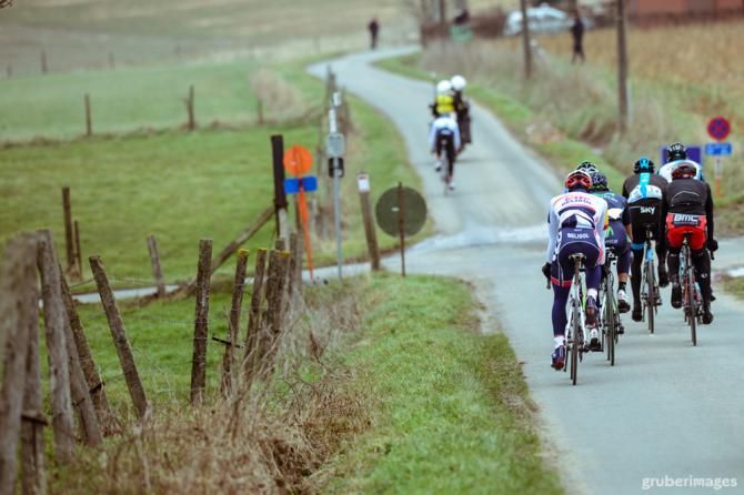 In their sights: a group chases down a lone rider in Gent-Wevelgem