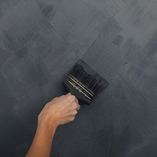 wall paint with paint brush