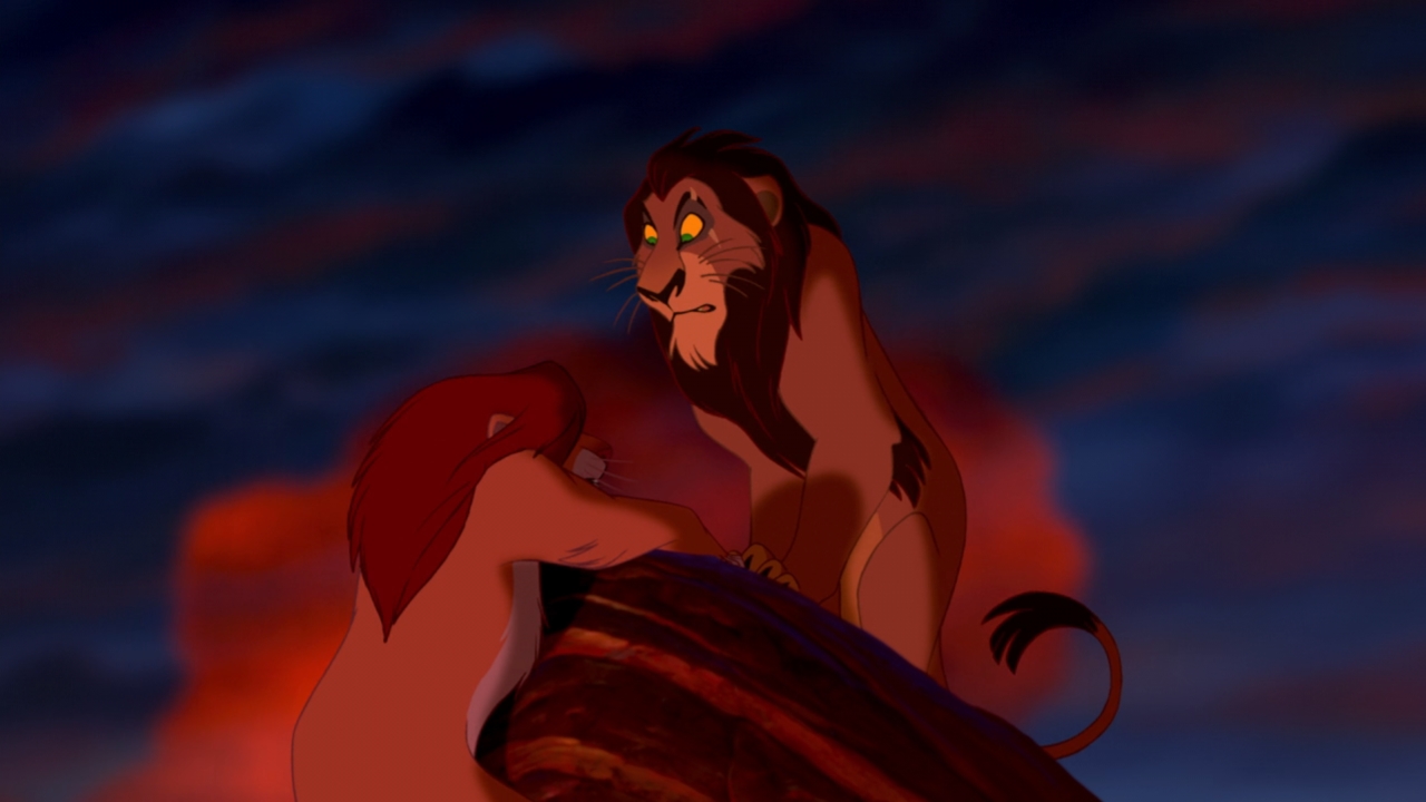 Scar standing a over a falling Simba