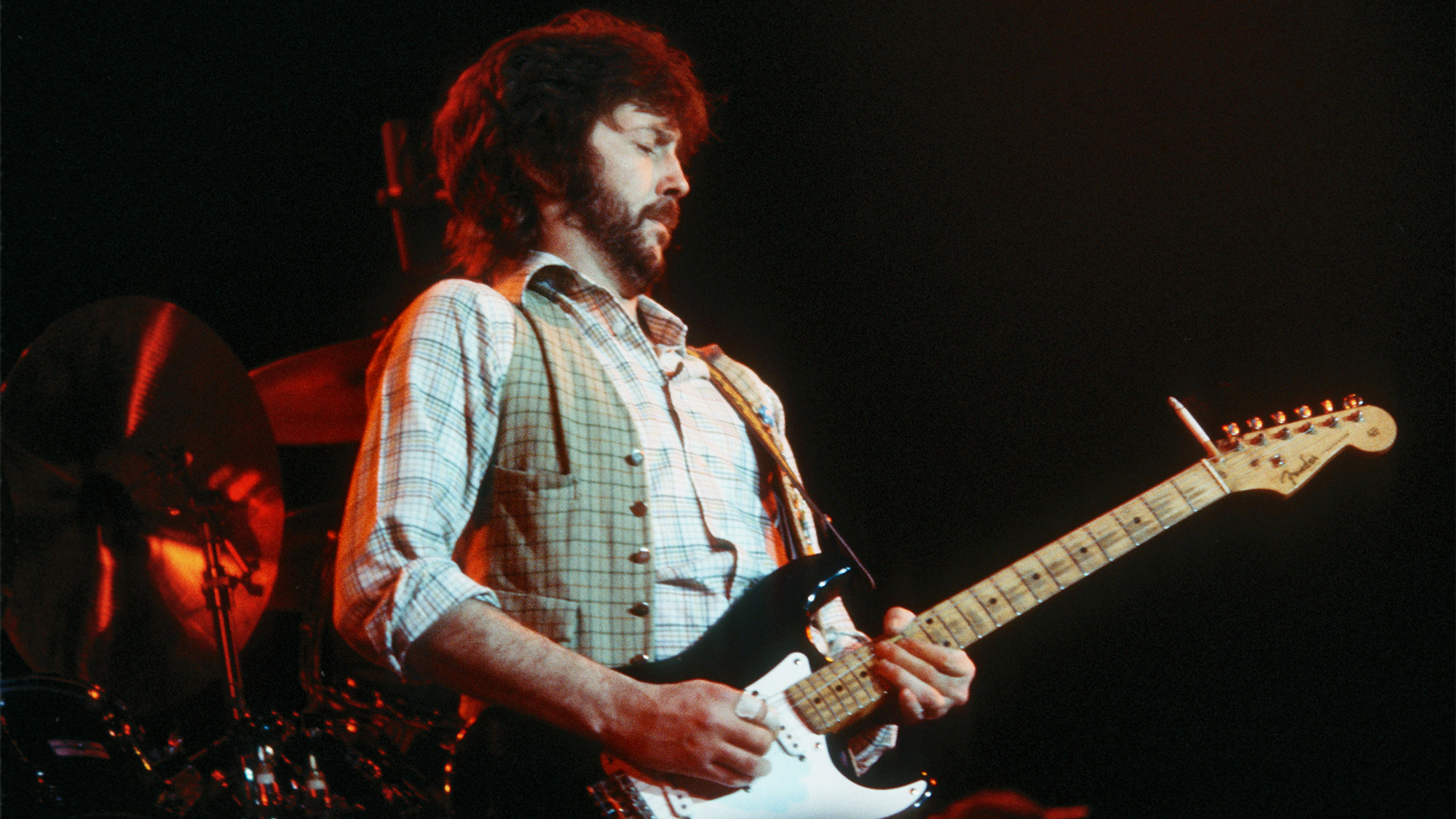 Eric Clapton plays guitar onstage at the Nassau Coliseum in April 1978