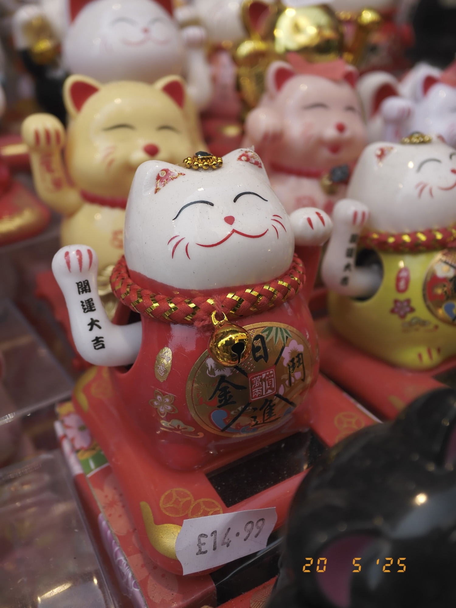 Closeup of maneki-neko in London's china town