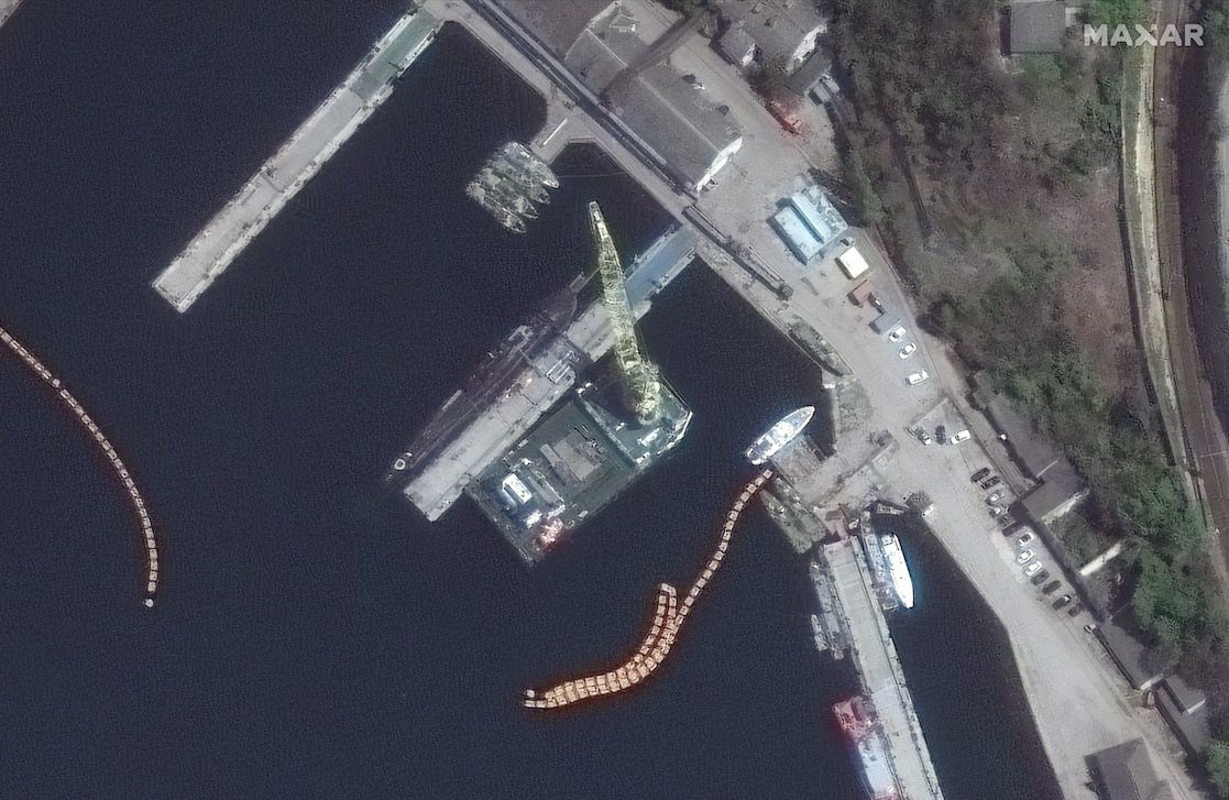 This photo, taken by Maxar Technologies&#039; WorldView-2 satellite, shows missiles being loaded onto a Russian Kilo-class submarine (center, to left of tall yellow tower) in the Black Sea port of Sevastopol on April 29, 2022.