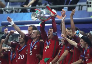 Portugal players celebrate with the trophy after winning Euro 2016