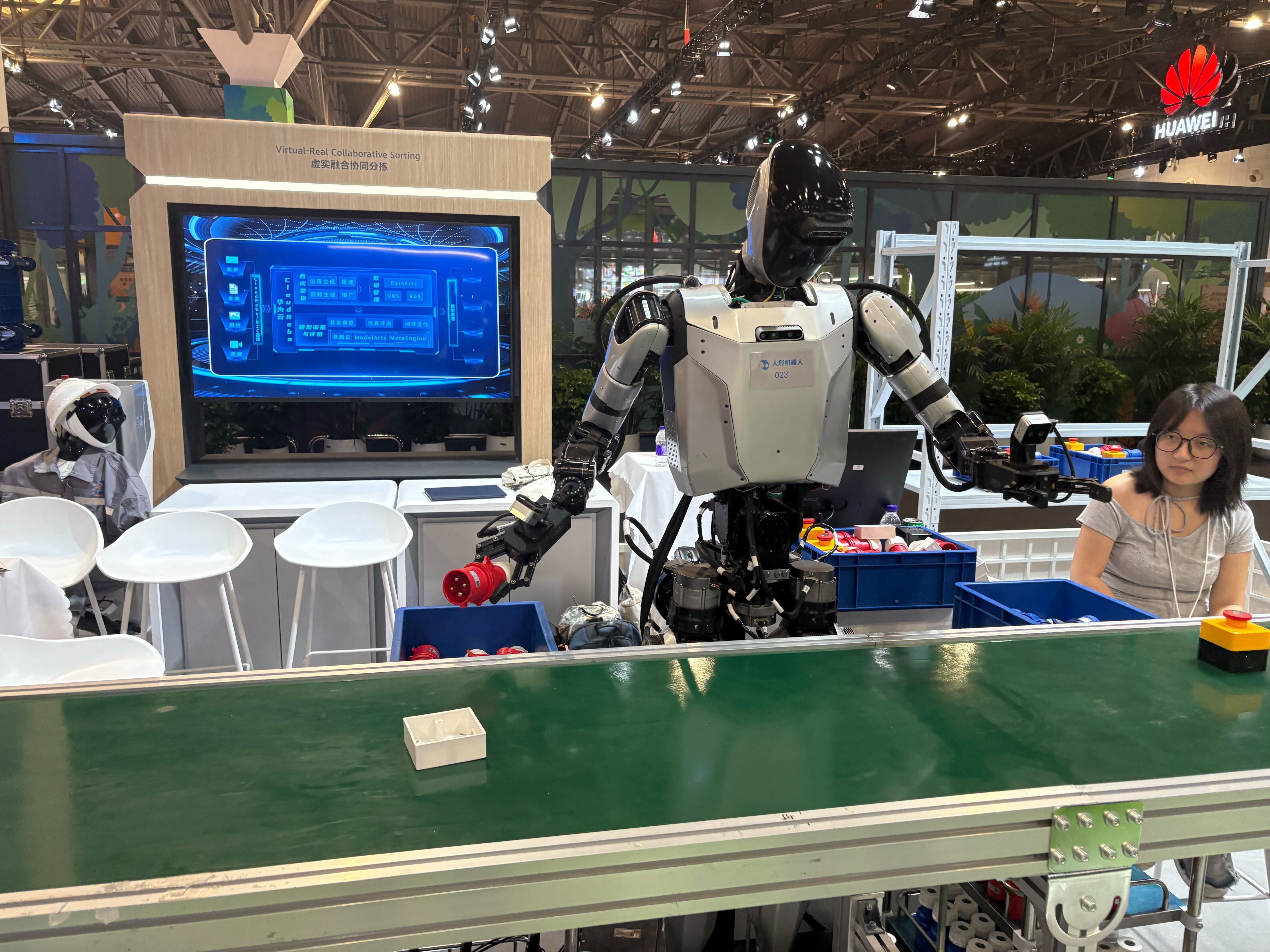 An image of a humanoid robot working on a production line