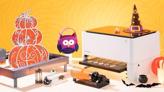 The best xTool machines; a photo of the xTool M1 laser cutter on a table surrounded by halloween gifts
