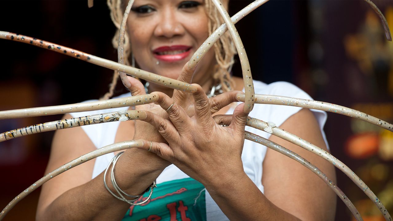 Ayanna Williams displays her 23 inch nails at the launch of Ripley&#039;s Believe It Or Not 2015 Annual in London. (Photo by Zak Hussein/Corbis via Getty Images)