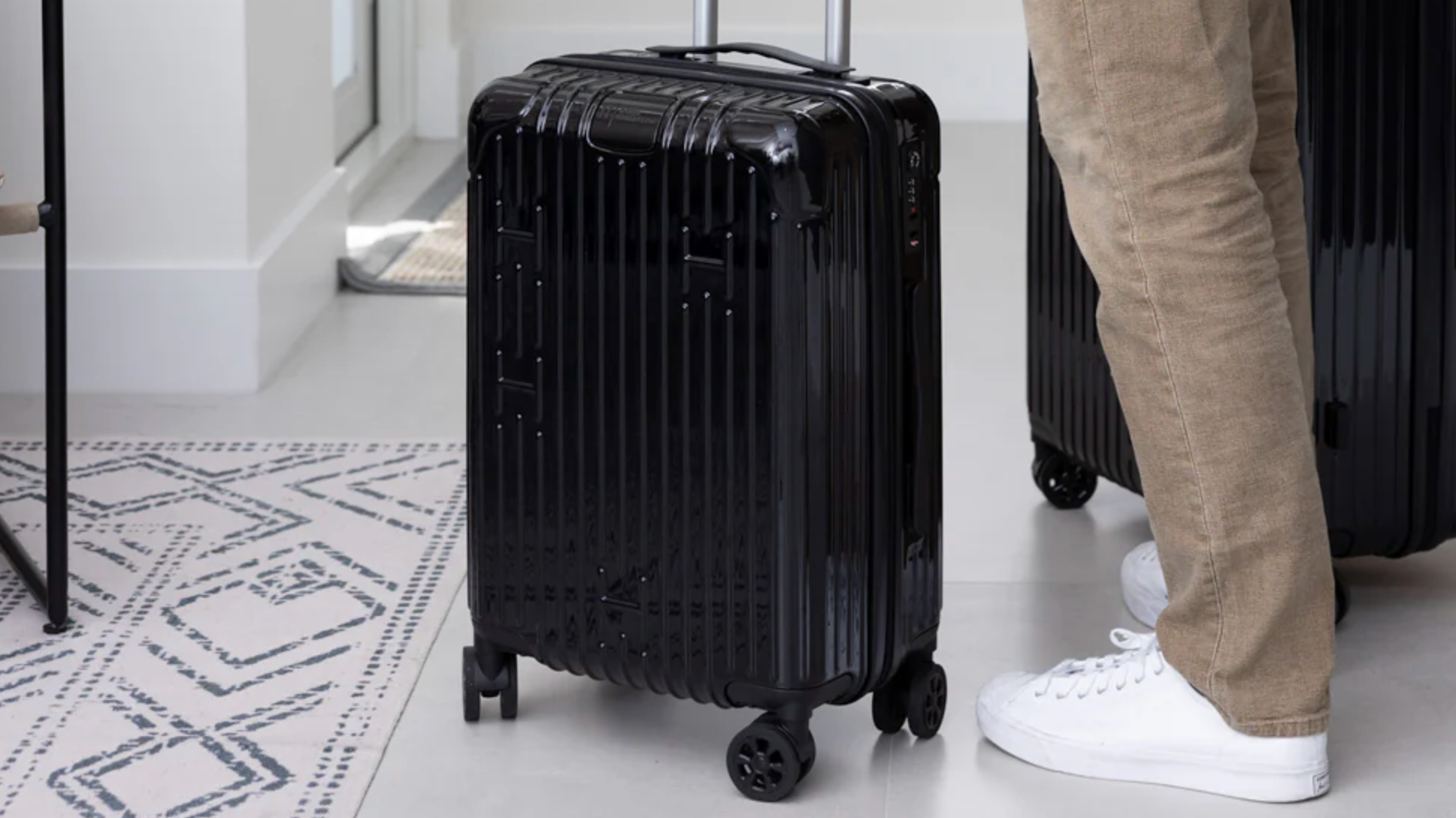 Person holding the Hotel Collection Carry-On Luggage