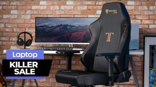 Secretlab Titan gaming chair with monitor, headphones and brick wall background 