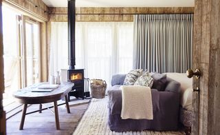 Fireplace and Wooden table in a Bathroom.