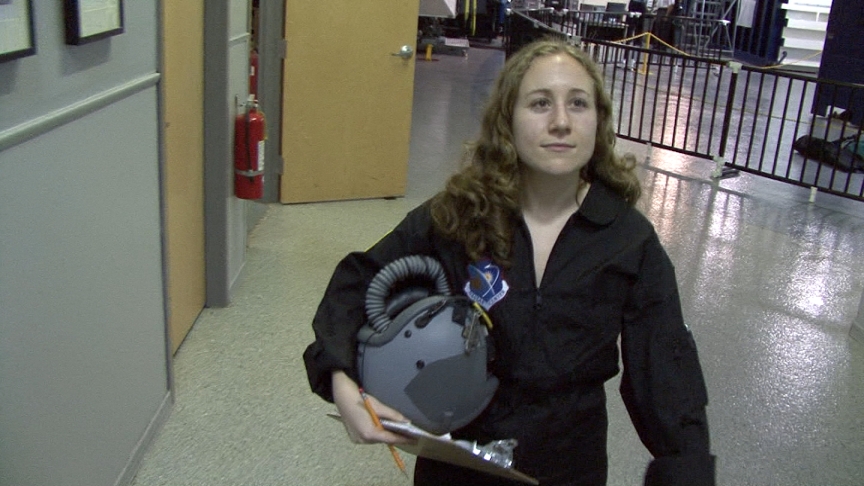 At NASTAR, we also underwent pressure training in a hypobaric chamber to feel what it&#039;s like when the air is slowly sucked out of a room (fun!). Here I walk toward the chamber holding my oxygen mask, which we wore in case we needed an emergency hit of air