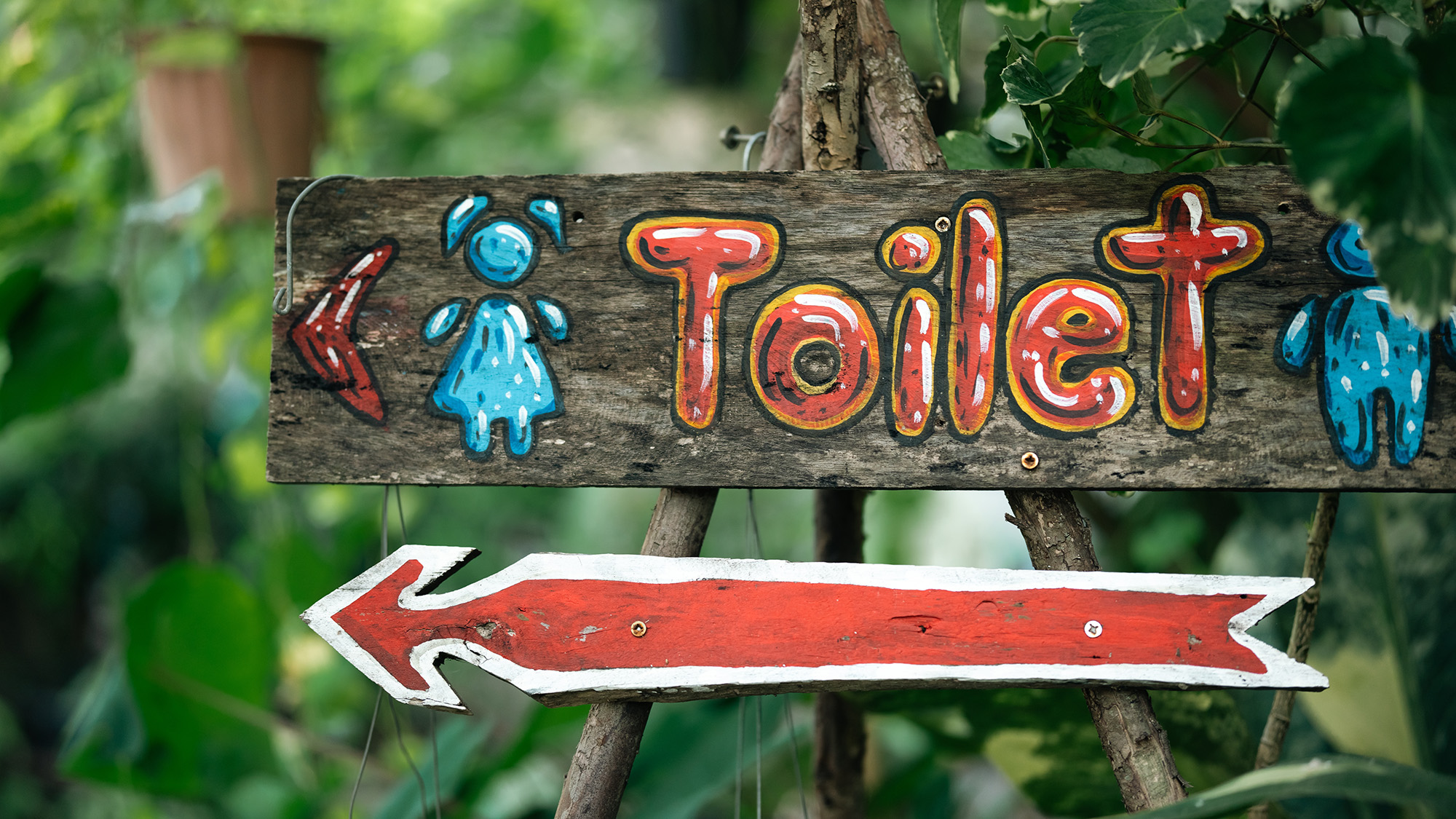 Toilet sign in garden