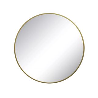 A circular mirror with a gold frame