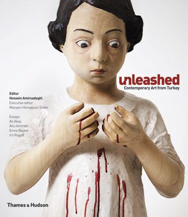 The cover of &#039;Unleashed: Contemporary Art from Turkey&#039; showing a wooden statue holding up blood covered hands