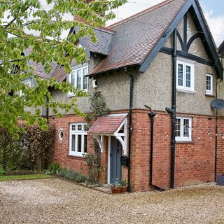 Brick house with gravel drive