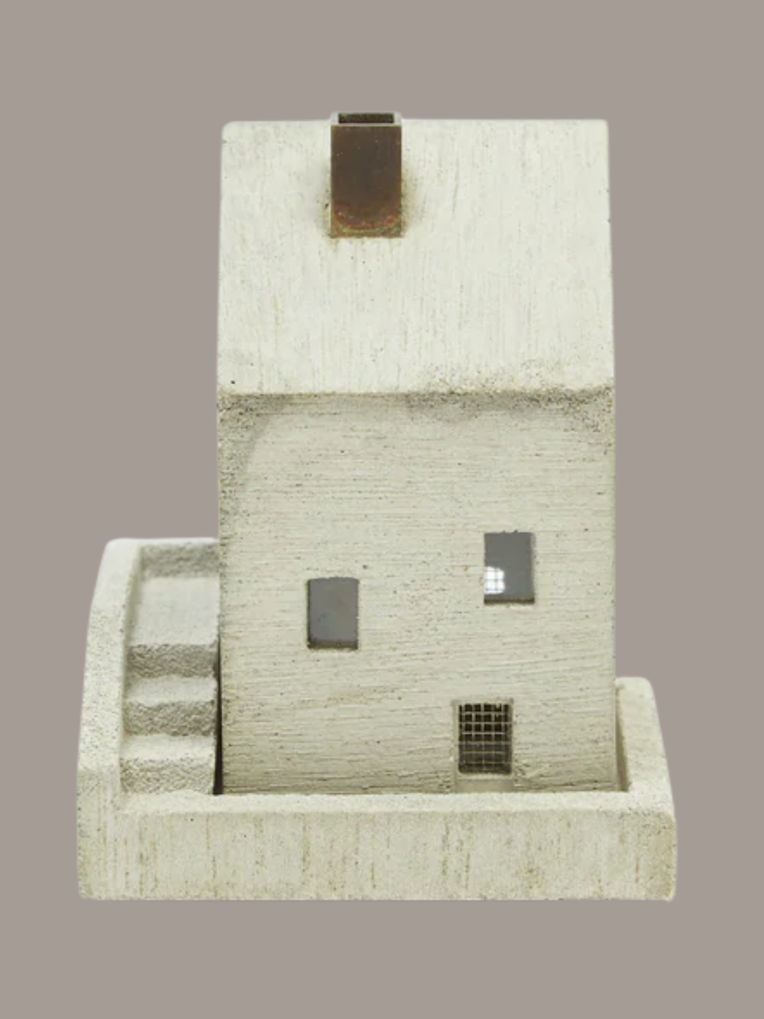A concrete incense burner in the shape of a home from Pull Push Japan