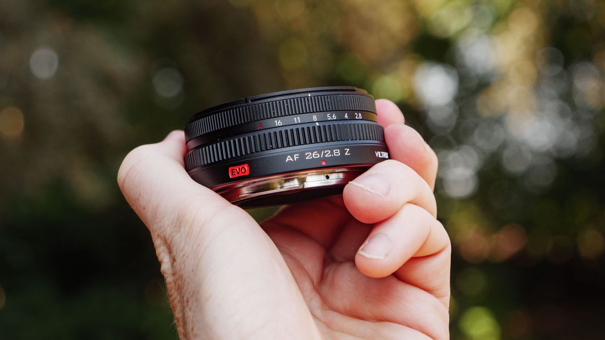 Viltrox AF 26mm F2.8 EVO 'pancake' lens in TechRadar's Cameras Editor Tim Coleman's hand
