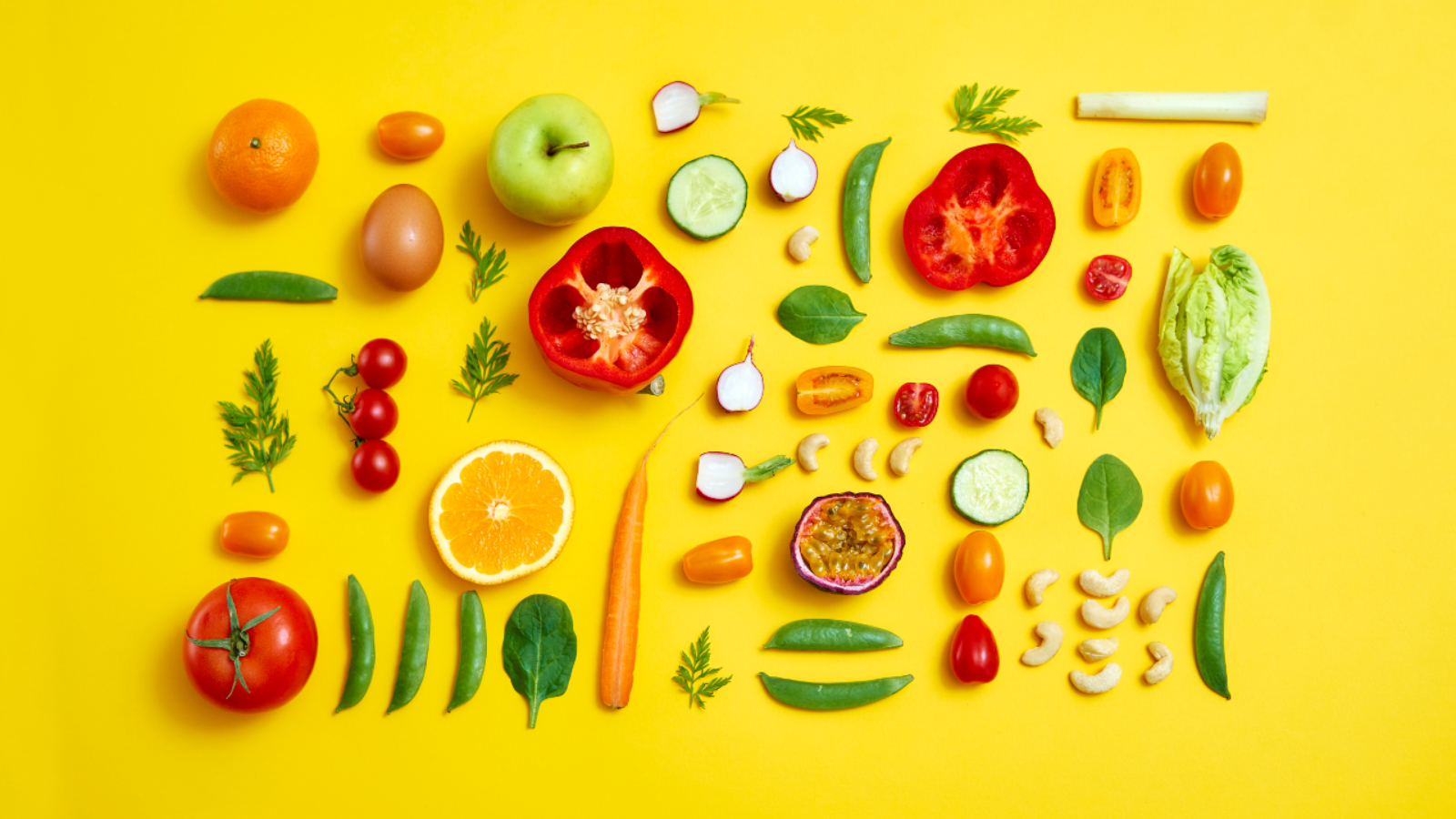 Fruit and vegetables on yellow background