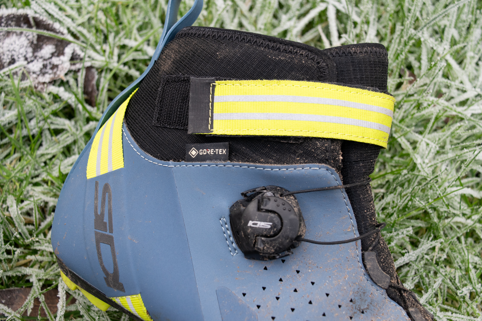 A blue Sidi Nix winter boot on frosty grass