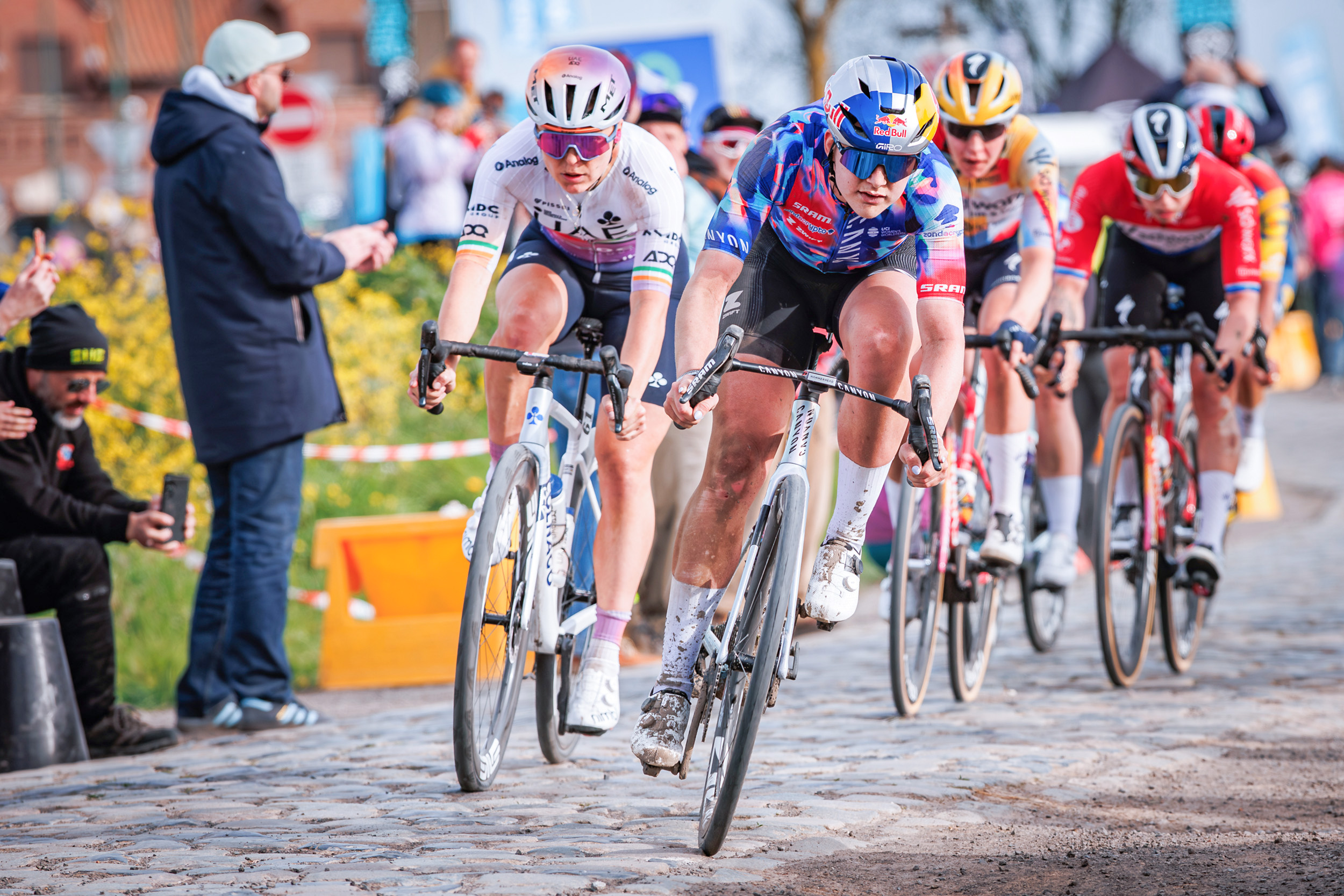 Lara Gillespie and Zoe B&amp;auml;ckstedt lead the peloton through a cobbled sector at the 2026 Paris-Roubaix Femmes
