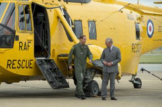 Prince William Shows Prince Charles The Sea King Helicopter He Flies During His Search And Rescue Missions From Raf Valley On Anglesey, Wales.
