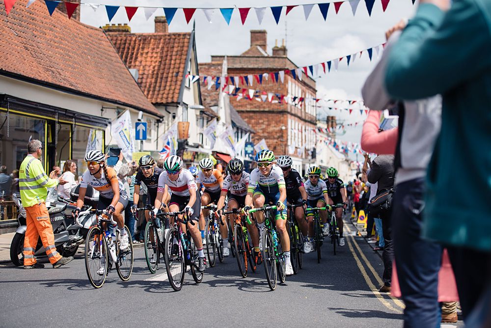 Speeding through streets lined with fans and bunting at Aviva Women's Tour 2016 - Stage 1
