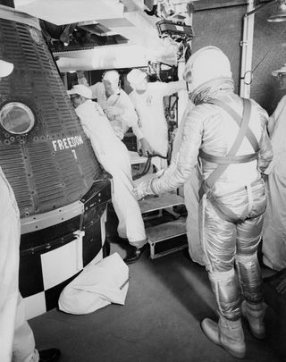 Alan Shepard prepares to board his Freedom 7 capsule. The spacecraft, which took Shepard to suborbital space in May 1961, originally came with portholes for viewing, but those were later changed to a trapezoid-shaped window. For spacecraft builders, putting in windows was once viewed as offensive to an engineer's sense of structural integrity and design elegance.