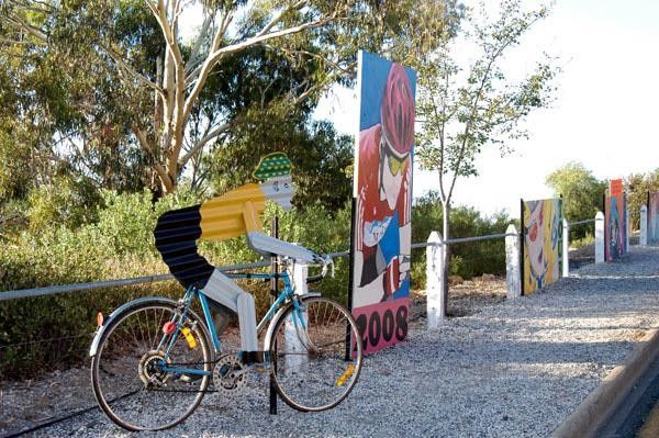 A corrugated iron cyclist decorates