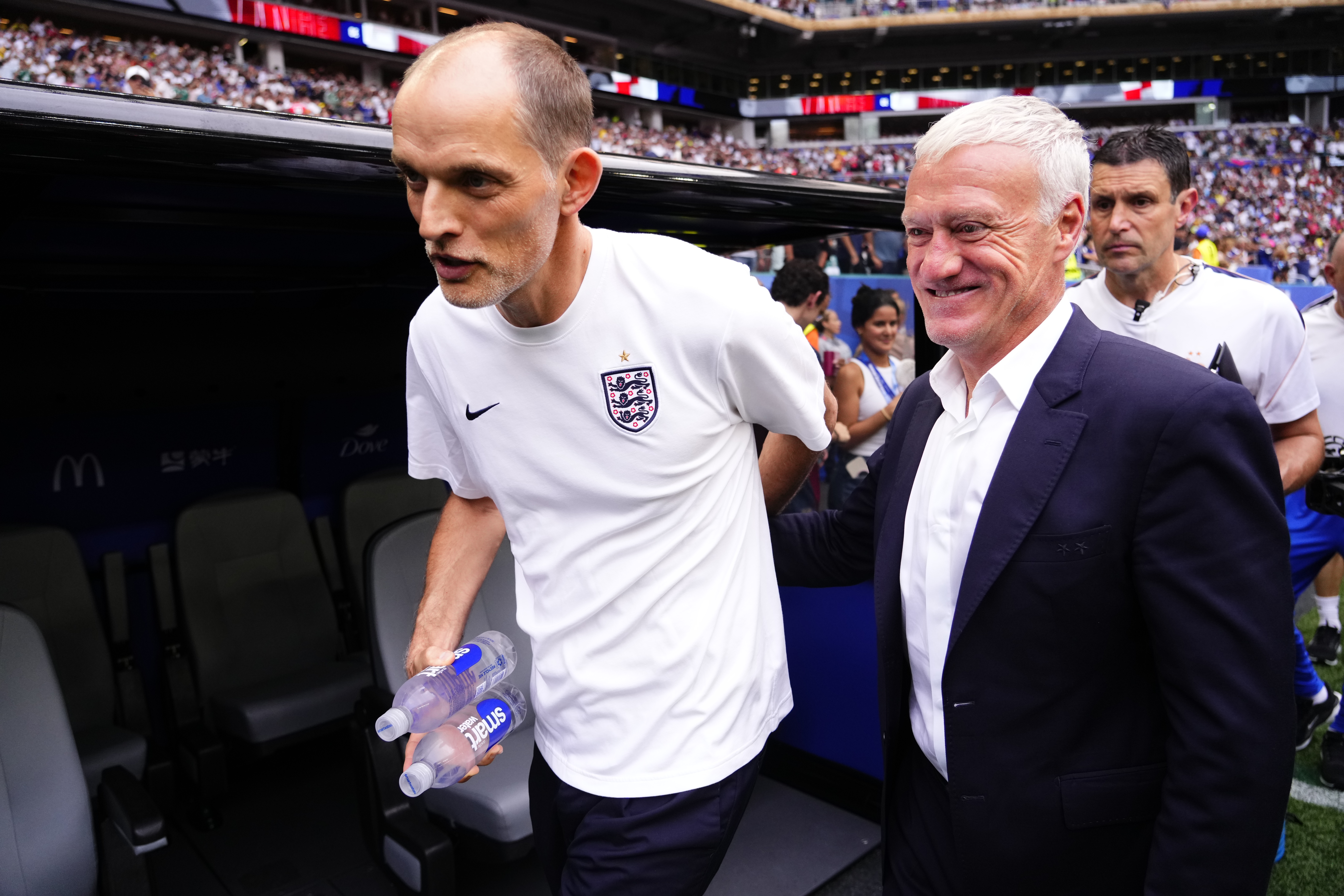 MIAMI GARDENS, FLORIDA - JULY 18: Thomas Tuchel, head coach of England, greets Didier Deschamps, head coach of France during the 2026 FIFA World Cup bronze-final match between France and England